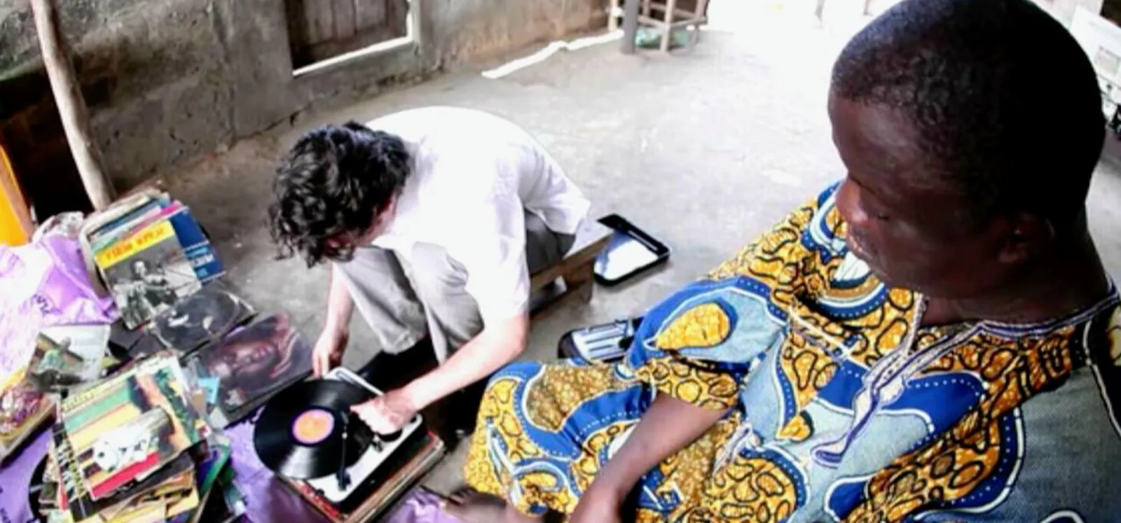 Photos of Greg playing a record